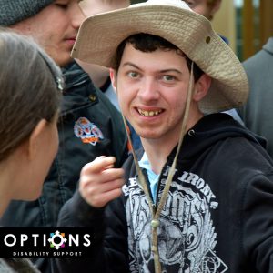 Man in a hat standing in Edible Garden