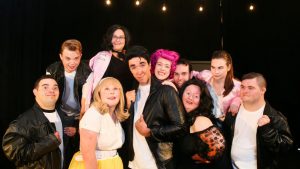 cast of the performance GREASE in costume